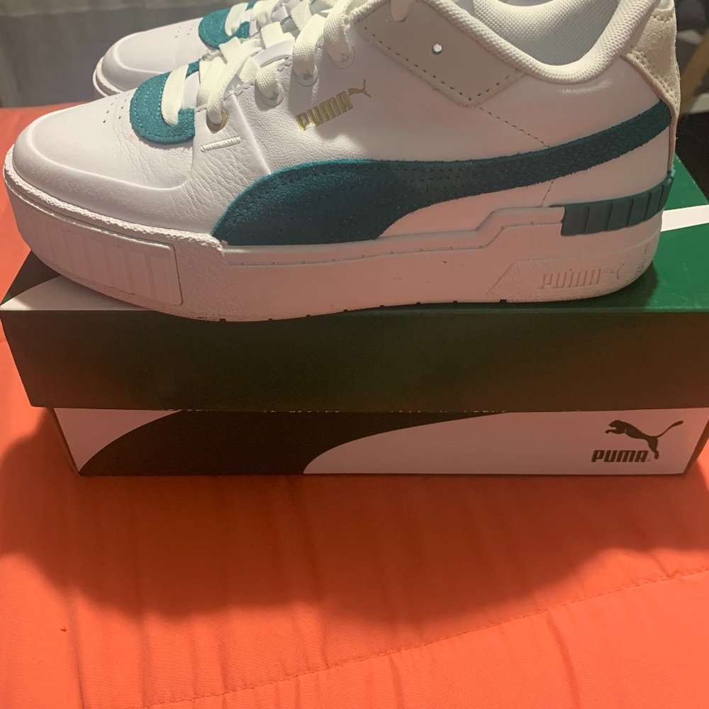 Puma women's Cali Sport Heritage Chunky Sole Sneaker in white and teal